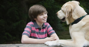 Boy having a conversation with his dog
